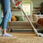 Senior downsizing cleaning tips image of vaccuuming.
